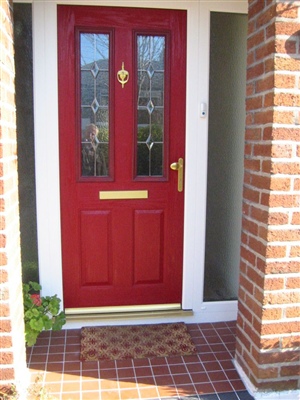 Red Composite Door with a White Frame